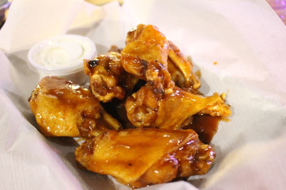 Traditional wings ($8.99) are bone-in and can be served in a variety of sauces. (Peyton MacKenzie/Community Impact Newspaper)