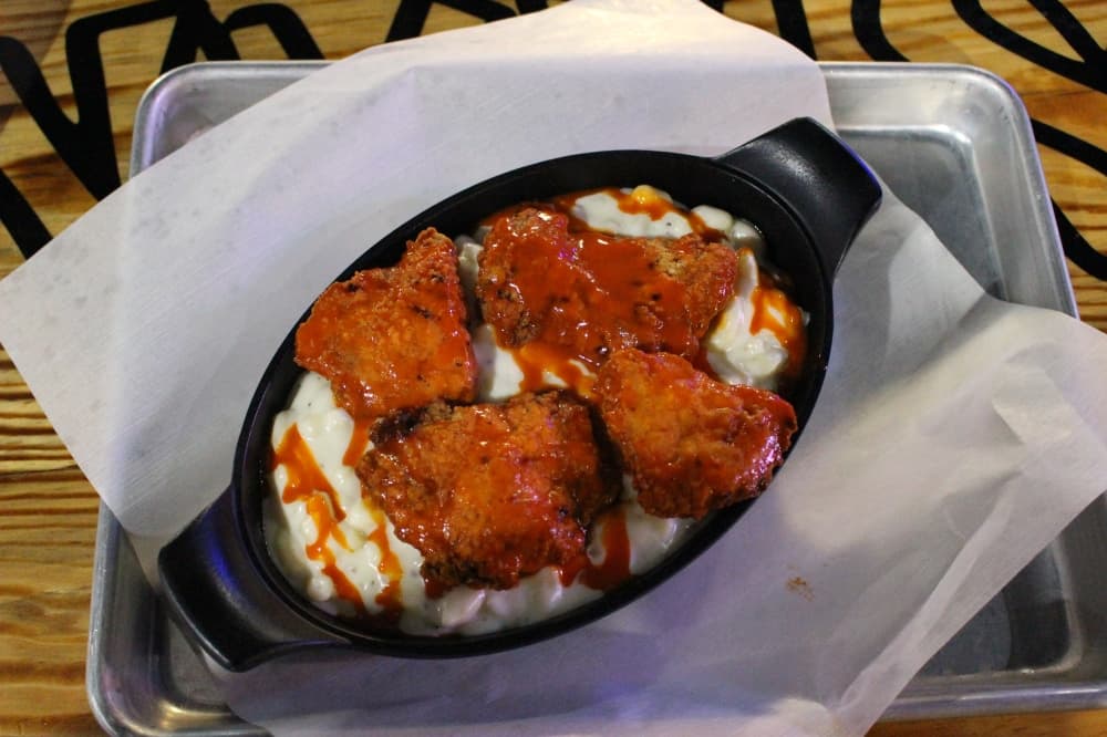 Buffalo Mac N Cheese ($8.99) is a creamy macaroni topped with boneless wings. (Peyton MacKenzie/Community Impact Newspaper)