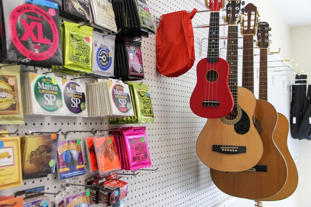 The school also sells items for beginner and advanced musicians alike, including guitars and strings. (Wesley Gardner/Community Impact Newspaper)