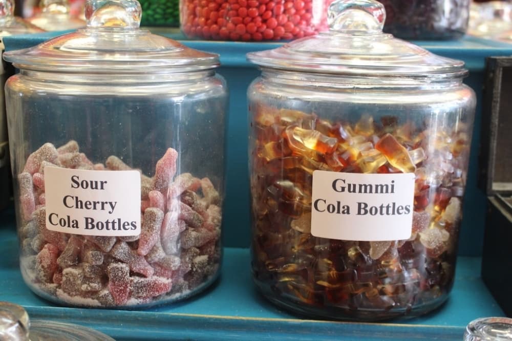 Candy jars are shelves across the store. Scoops of candy cost $12 per pound. (Jishnu Nair/Community Impact Newspaper)