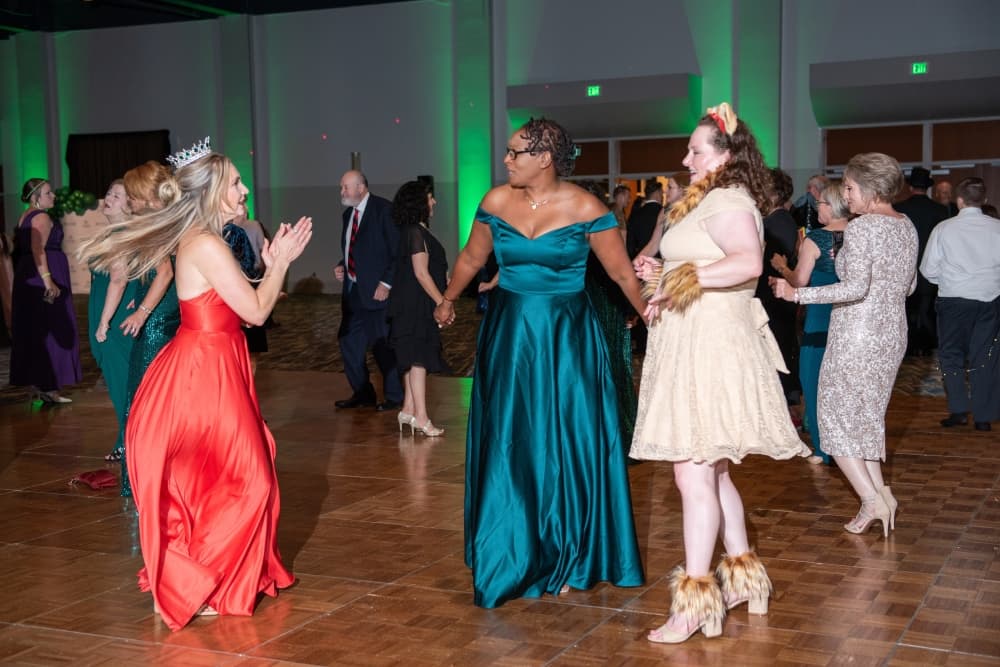 Attendees wearing ballgowns and themed costumes enjoyed dinner and dancing at the Chairman’s Ball. (Courtesy Tara Flannery Photography)