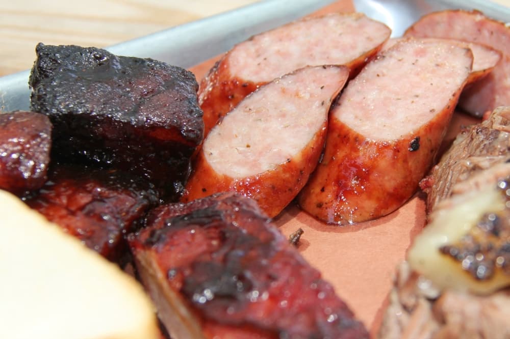 The fan-favorite pulled pork and sausage are among the meat options offered at Texas Q in Kingwood. (Wesley Gardner/Community Impact Newspaper)