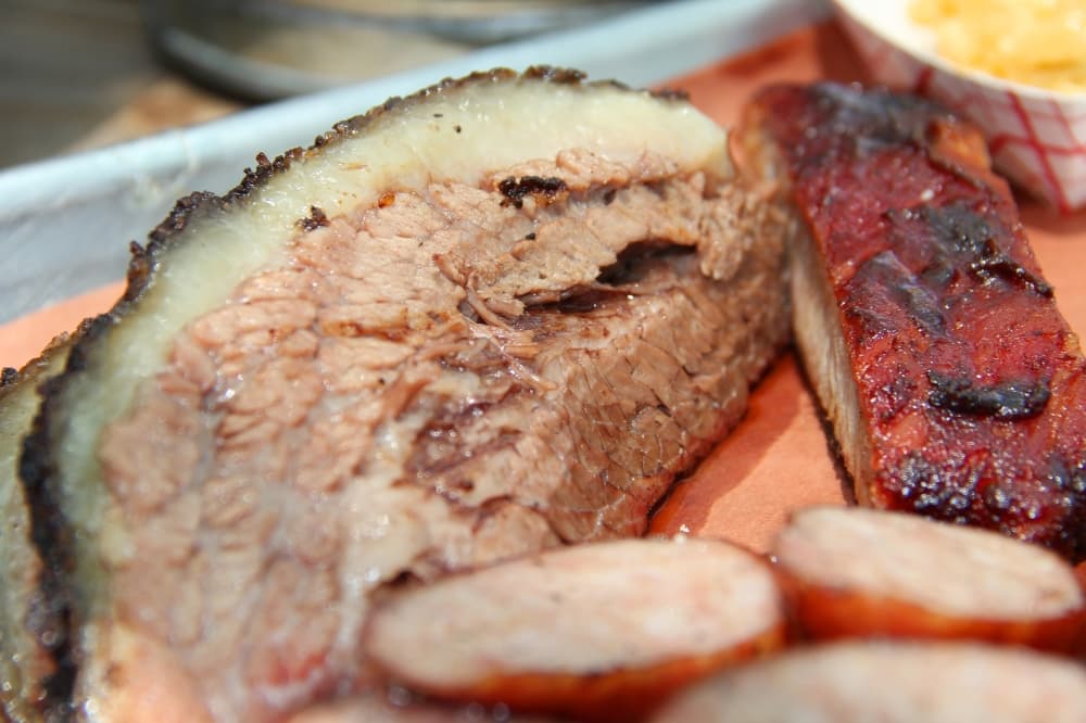 The prime black Angus brisket and pork spare ribs can be included in the two-meat, two-sides combo at Texas Q, or purchased by the pound. (Wesley Gardner/Community Impact Newspaper)