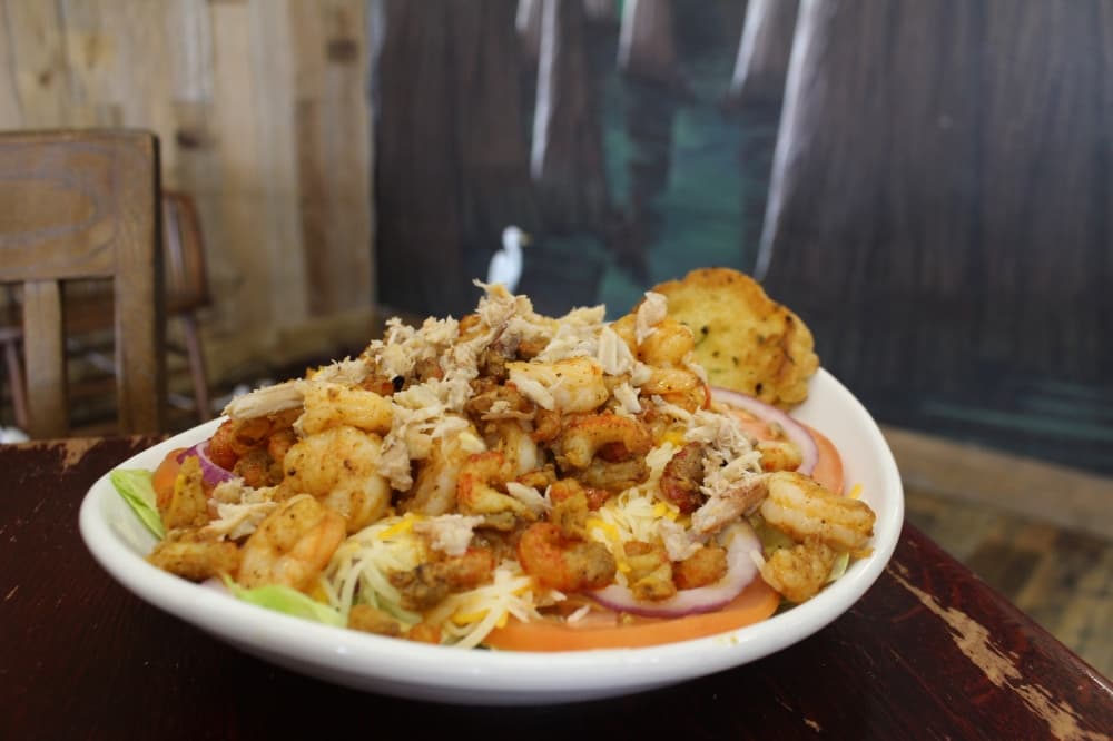 The seafood salad ($14.75) includes lettuce with shrimp, crab and crawfish with a choice of dressing. (Kayli Thompson/Community Impact Newspaper)