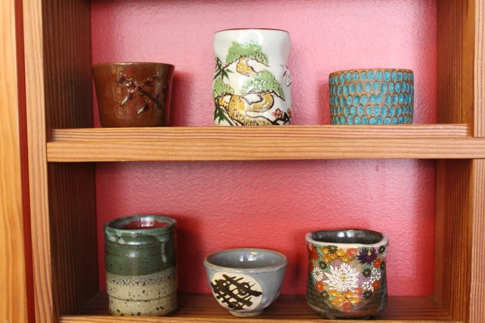 
Guests at The Path of Tea can choose their tea cup from a shelf of options. 