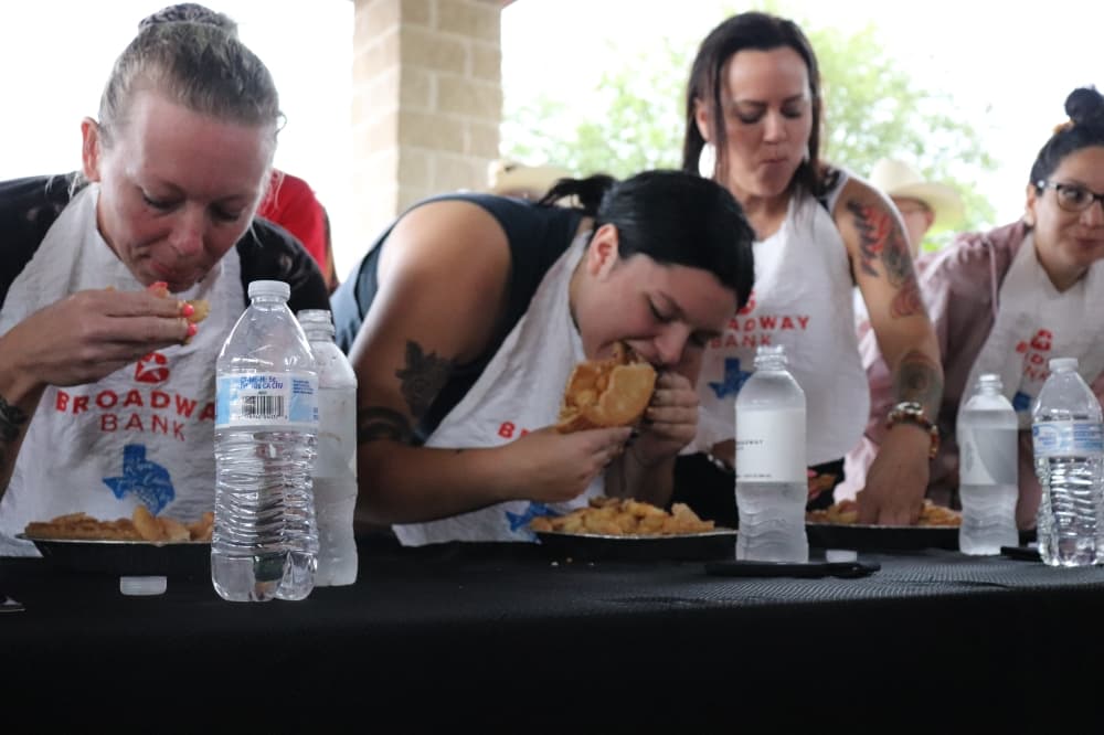 About a dozen festival attendees competed in the pie-eating contest. (Zara Flores/Community Impact Newspaper)