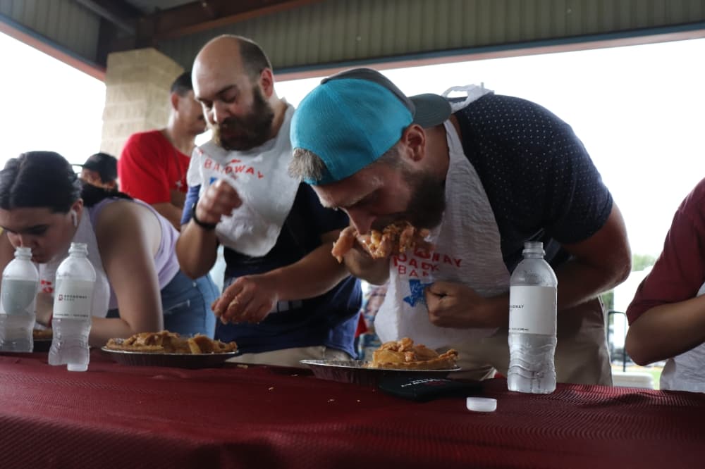 About a dozen festival attendees competed in the pie-eating contest. (Zara Flores/Community Impact Newspaper)