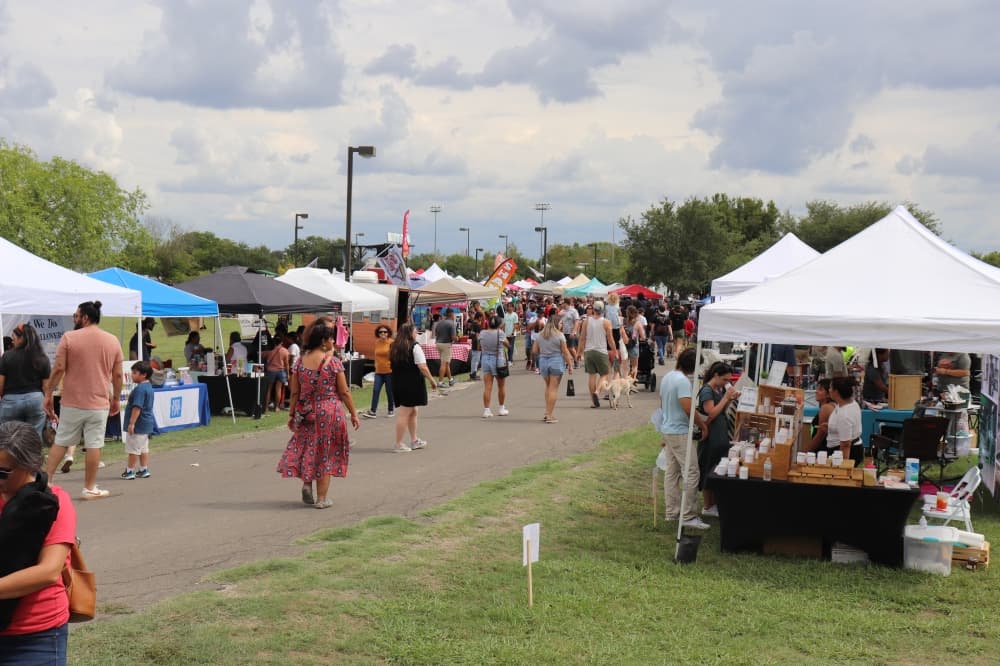 Dozens of vendors were set up throughout Gregg-Clark Park offering food, drinks, clothing and more. (Zara Flores/Community Impact Newspaper)