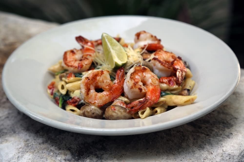 The Penne Pasta Grill ($14) comes with the option of a shrimp, chicken or vegetable and is tossed with white wine Parmesan cream sauce. (Courtesy Huisache Grill)