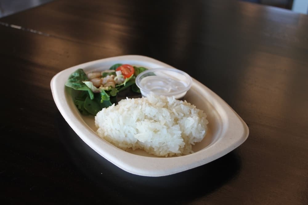 Sticky rice served with grilled pork.