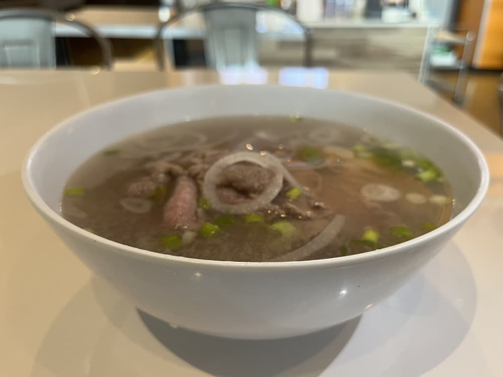 Pho served with thinly sliced steak ($11) is a popular menu item. (Tricia Schwennesen/Community Impact Newspaper)