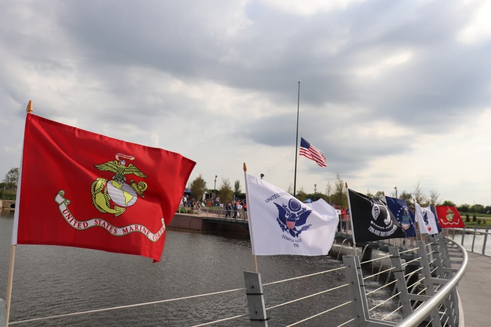 Various flags fly along the bridge. (Zara Flores/Community Impact Newspaper)