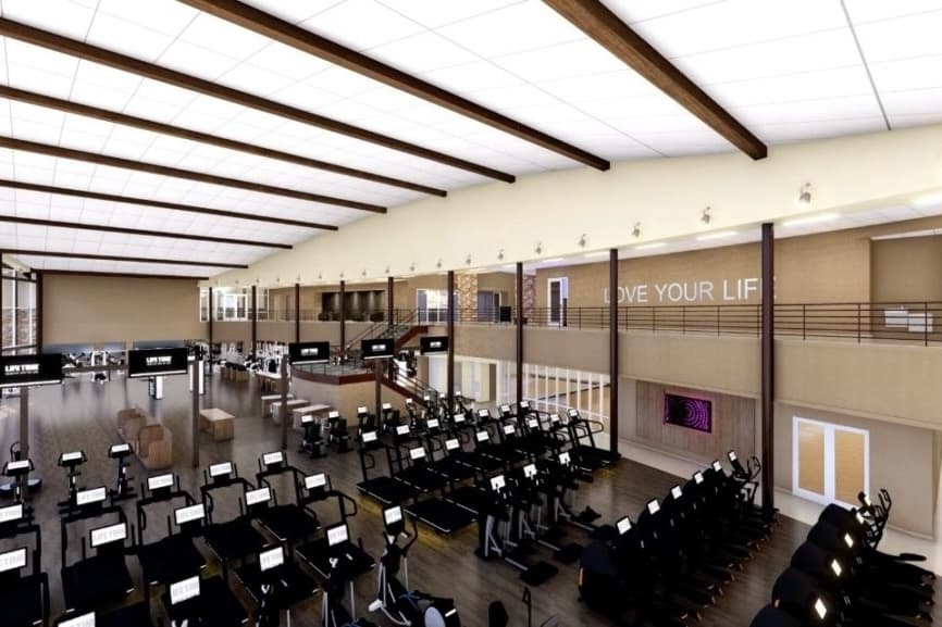 Rendering with an elevated perspective of a gym floor with workout machines.
