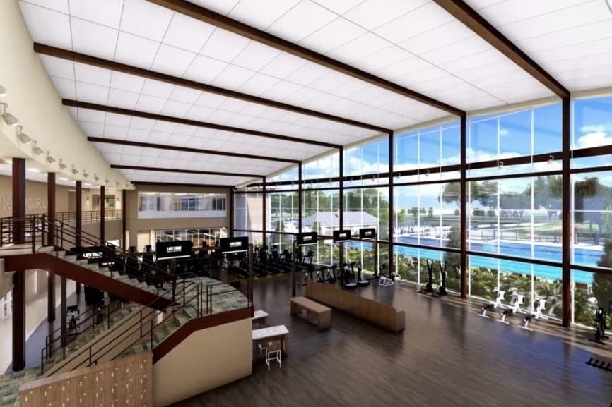 Rendering with an elevated perspective of the interior of the gym overlooking the outdoor pool.