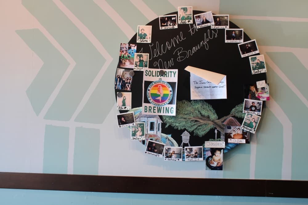 A picture collage promoting the union drive is hung on a wall inside the New Braunfels Starbucks. (Eric Weilbacher/Community Impact Newspaper)
