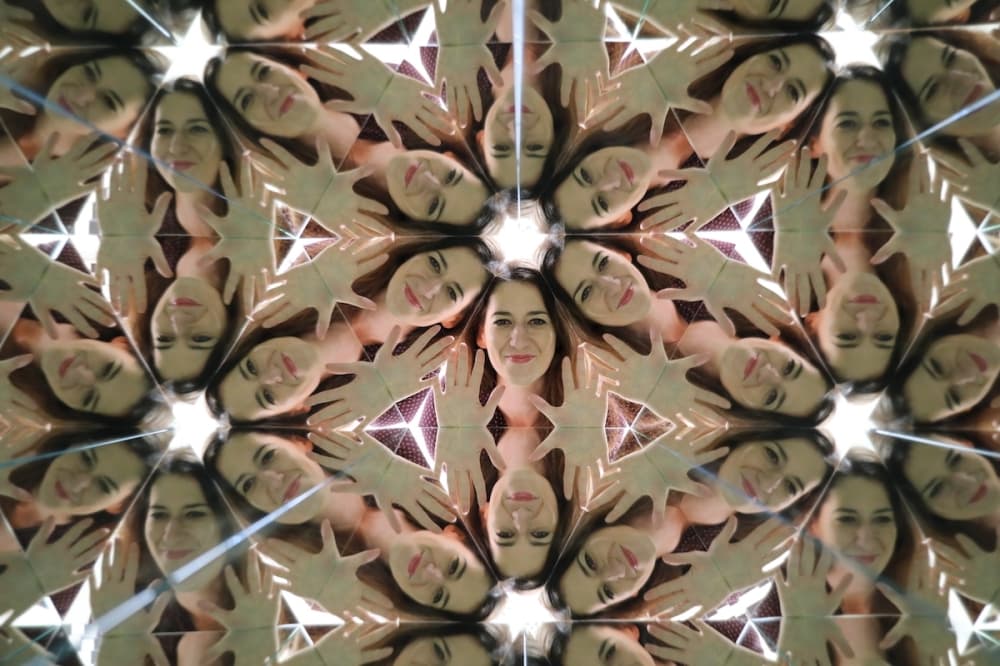 Kaleidoscope view with heads and stars