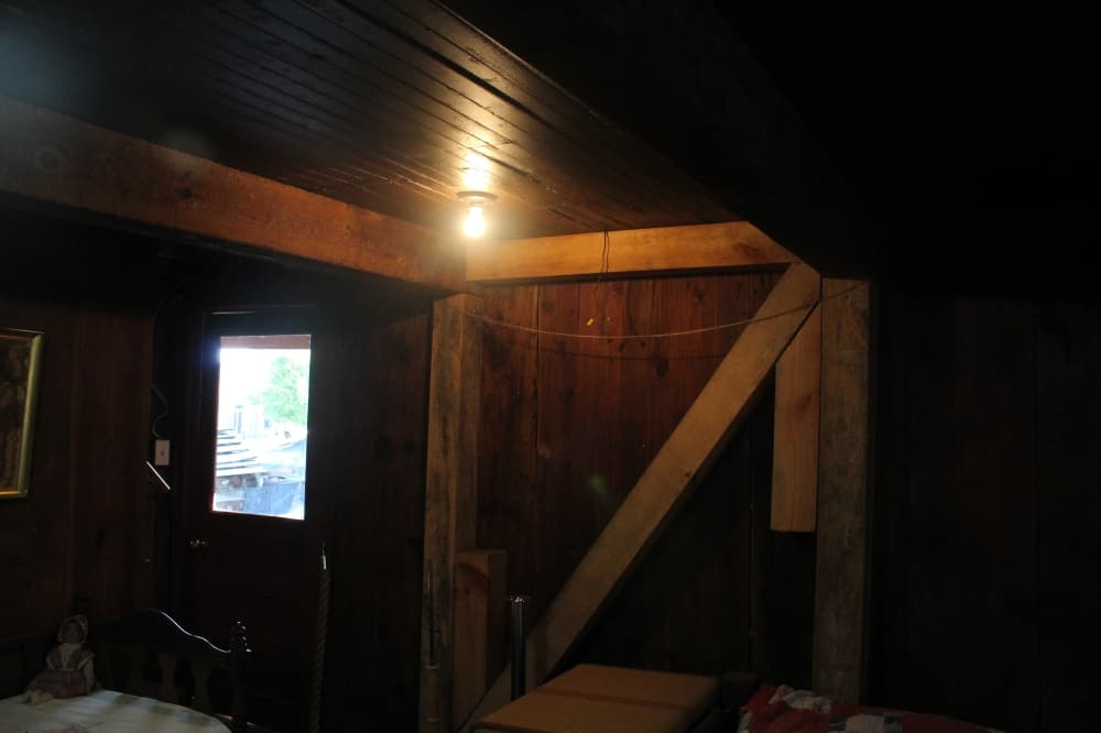 Inside of the Taylor House with light colored wood added for additional structural bracing.