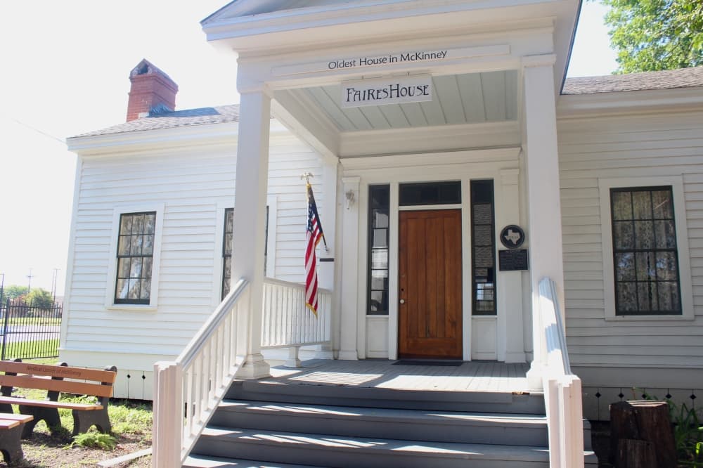 Front of the historic Faires House with a name sign over the entryway.