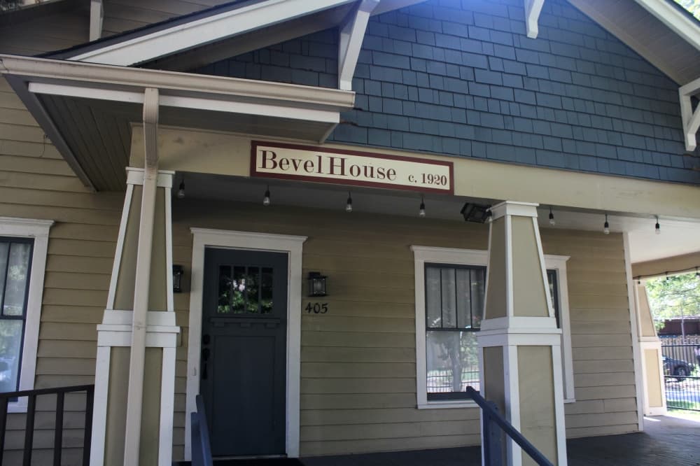 Front of historic Bevel House with a name sign over the entryway.