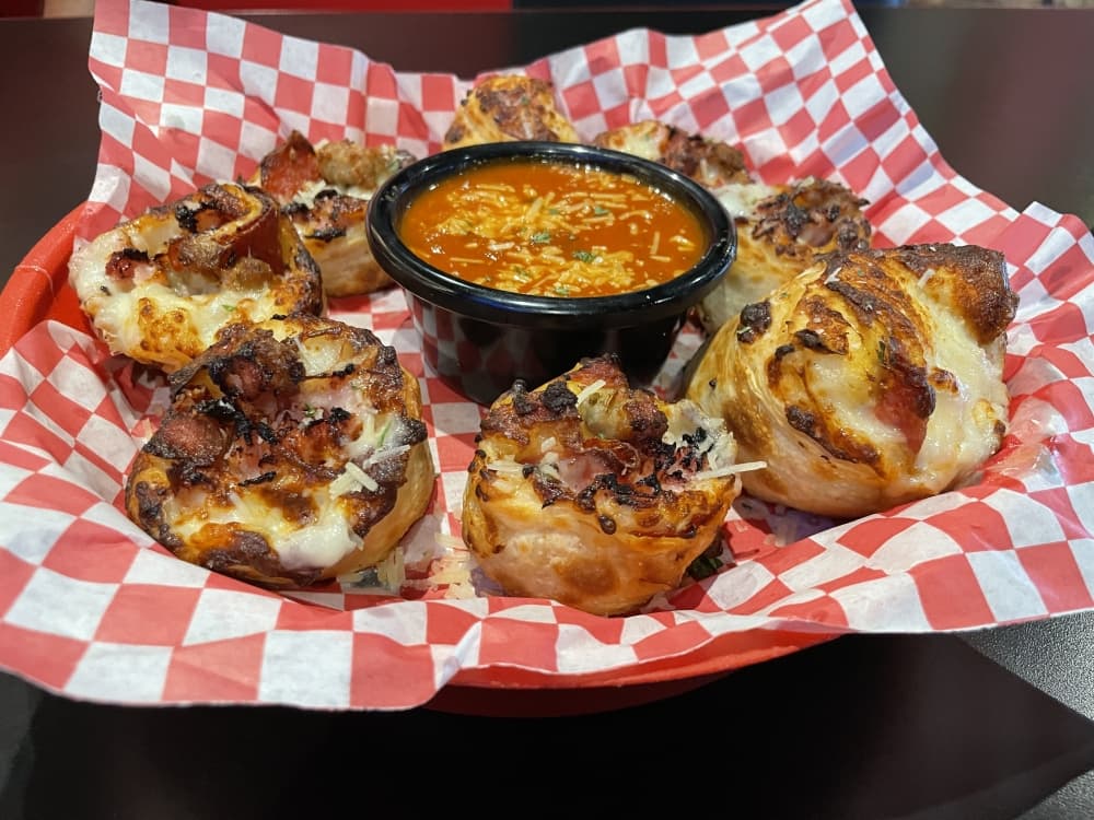 Texas Tornados ($8.99-$14.99) is mozzarella cheese, ham, pepperoni, Italian sausage and shredded parmesan rolled in fresh pizza dough and served with homemade marinara, Alfredo sauce or ranch for dipping. (Sarah Parker/Community Impact Newspaper)