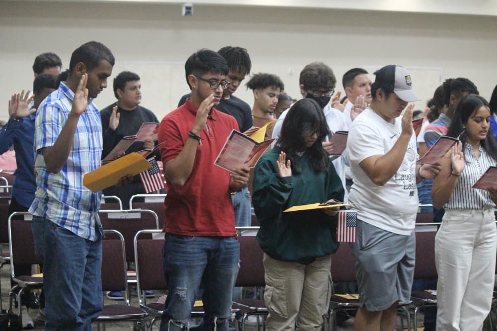 Candidates for U.S. citizenship take an oath of allegiance to the U.S., renouncing their prior country of citizenship. (Anna Lotz/Community Impact Newspaper)