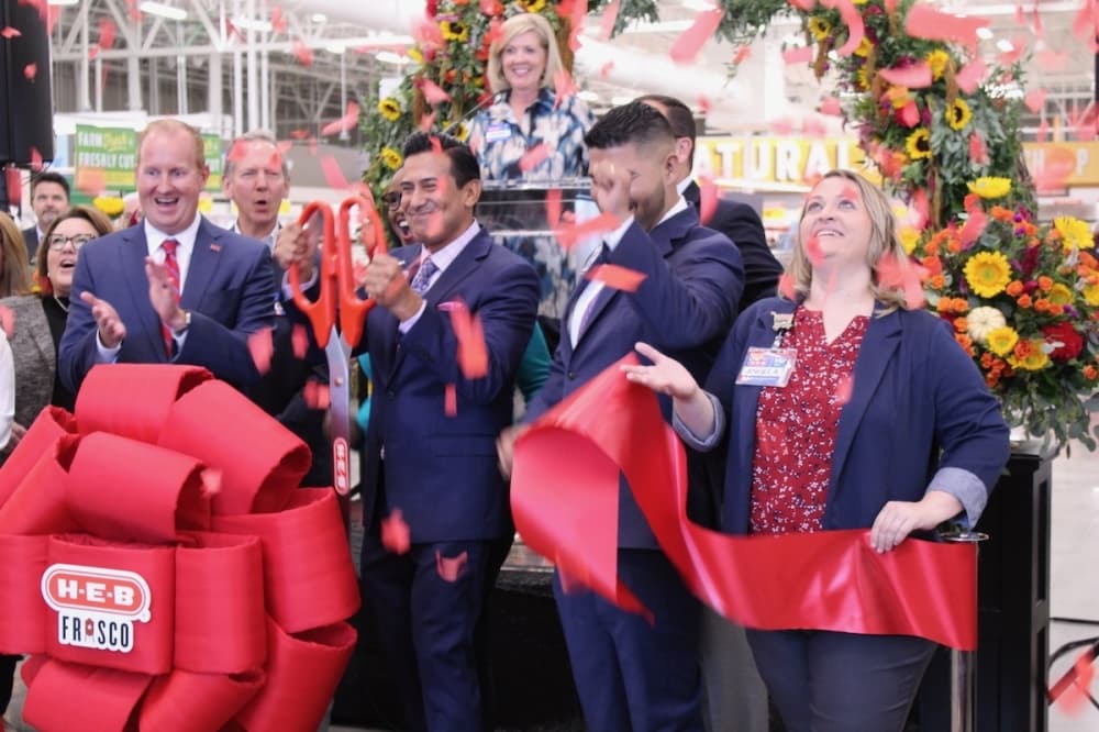 Confetti is released as the ribbon is cut on the new H-E-B in Frisco. (Colby Farr/Community Impact Newspaper)