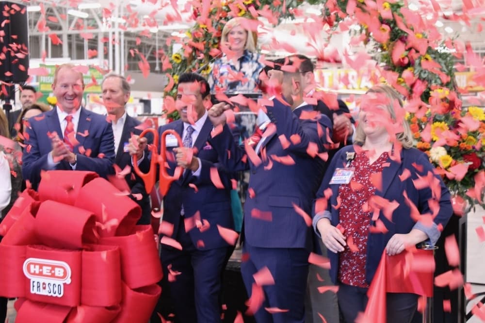 Confetti falls as the ribbon is cut for the new H-E-B in Frisco on Sept. 20. (Colby Farr/Community Impact Newspaper)