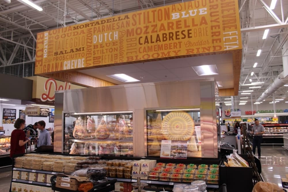 The cheese island at H-E-B in Frisco allows customers to build their own charcuterie boards or grab a premade one. (Colby Farr/Community Impact Newspaper)