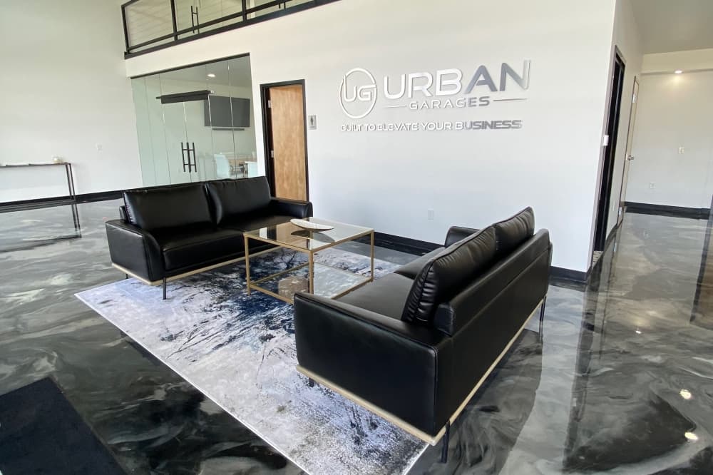 Interior of an Urban Garages' unit with two couches facing eachother and a coffee table in between them.