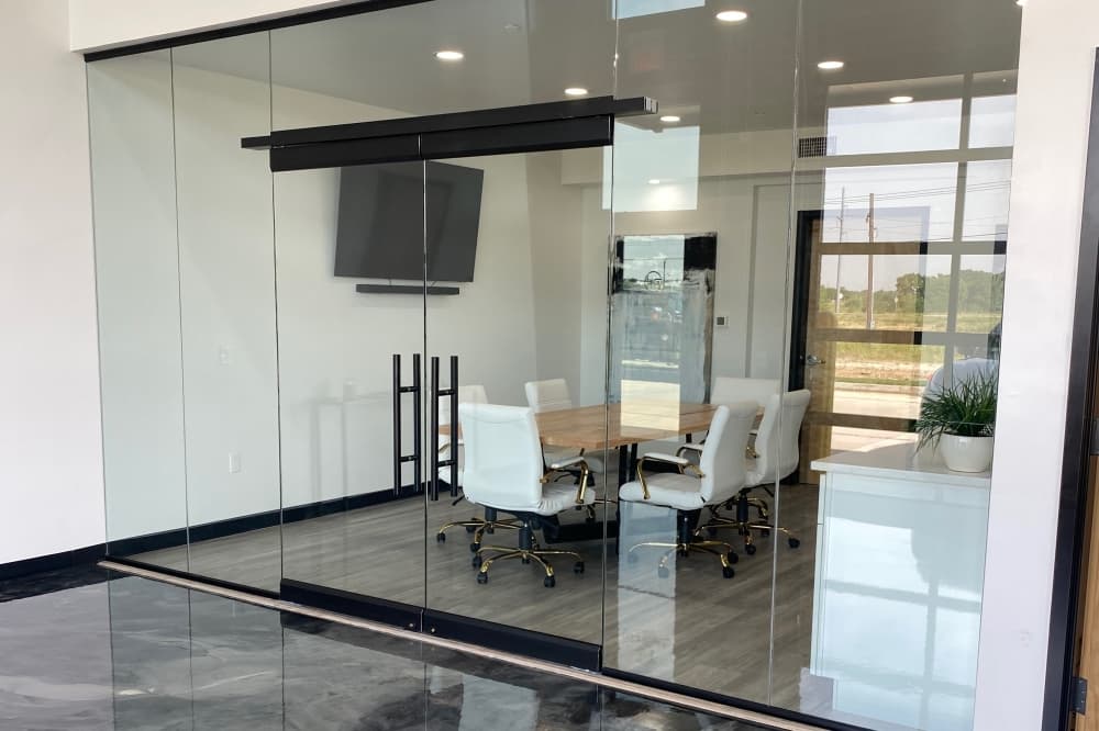 Interior of an Urban Garages' unit with a glass wall conference room.