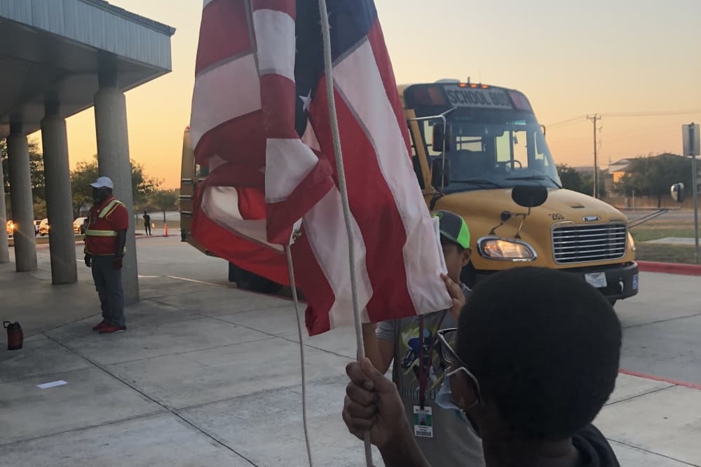 LOTC students raise the flag. (Judson ISD)