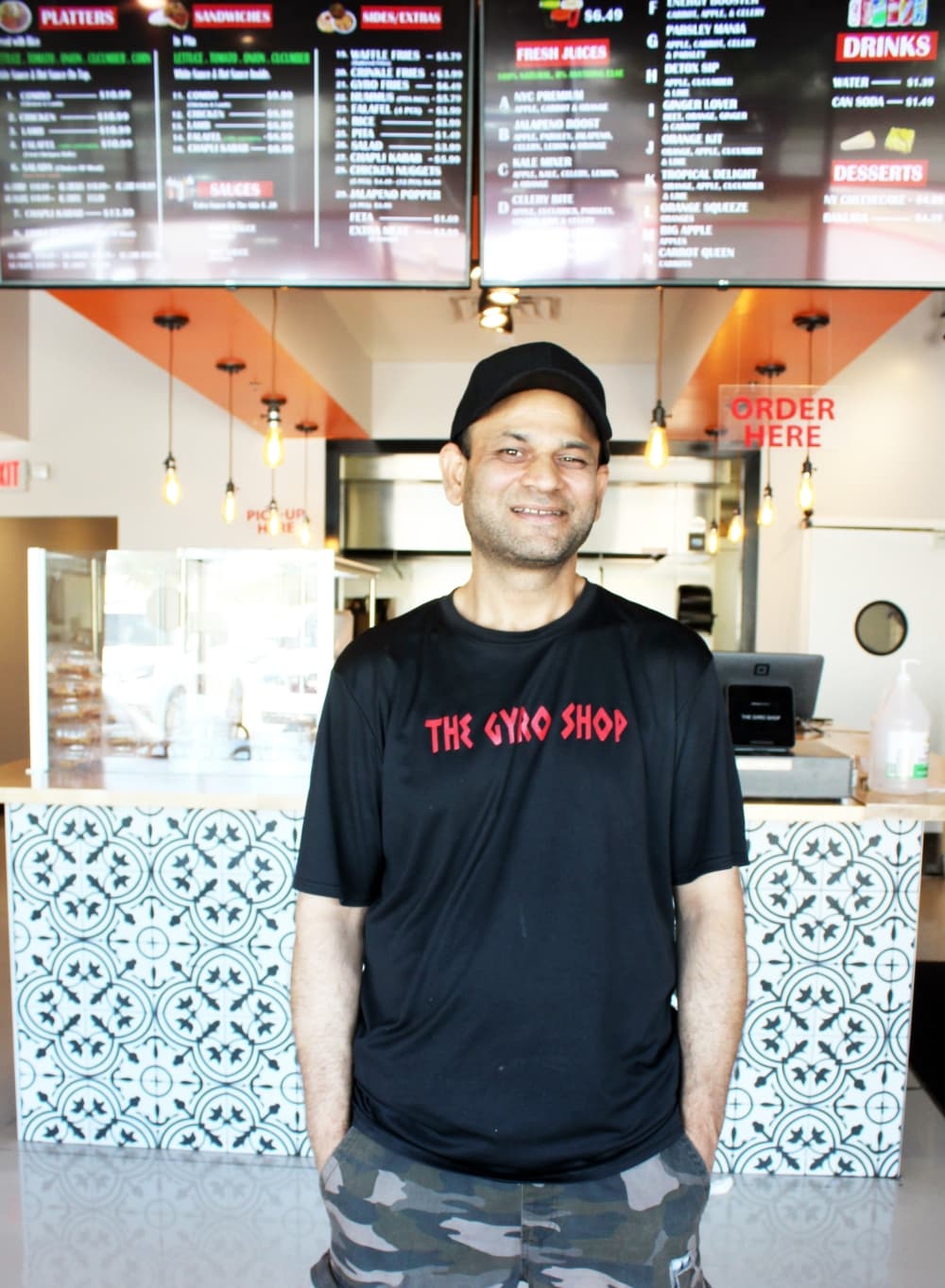 Faisal Maqsood co-owns The Gyro Shop with his brother and cousin. He operates the Frisco location, which opened in April 2021.  (Karen Chaney/Community Impact Newspaper)
