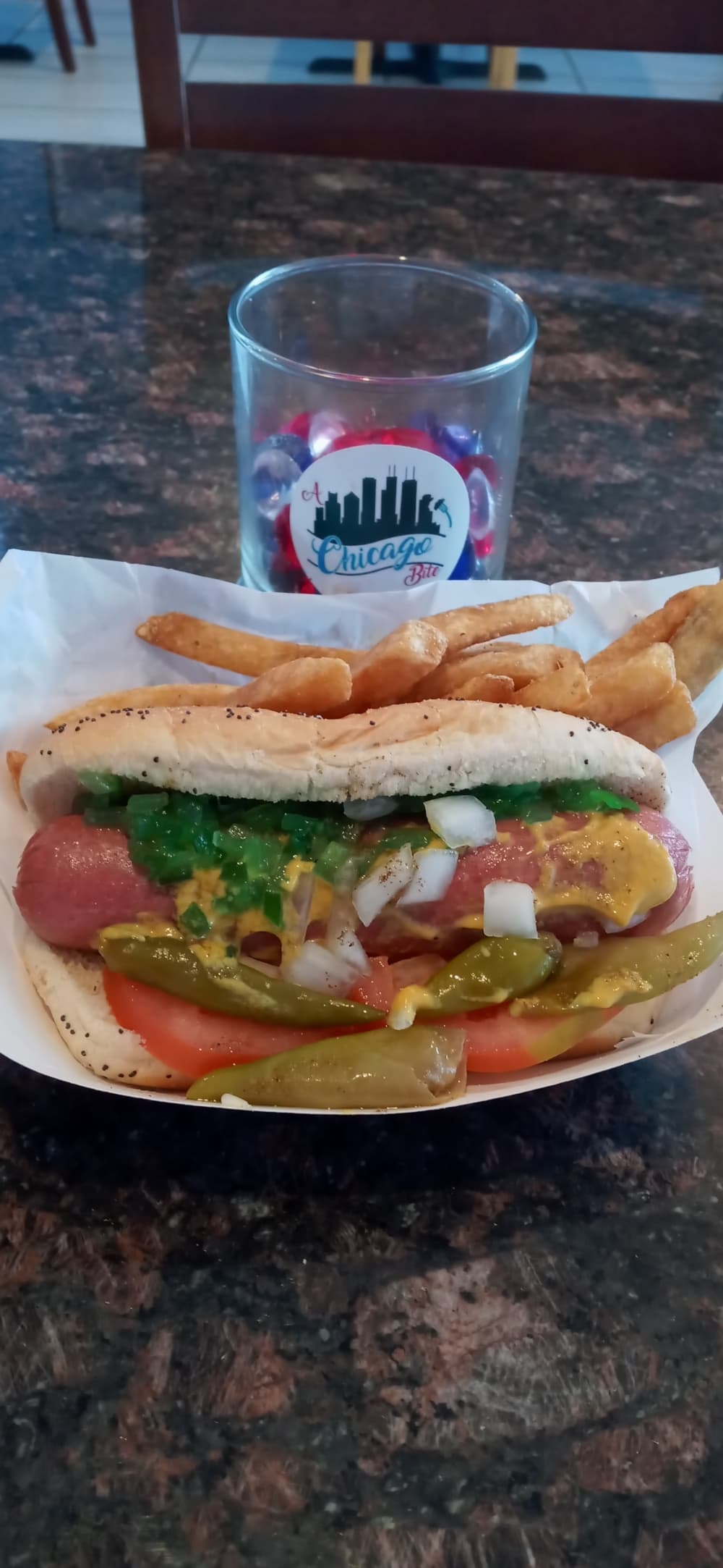 The menu includes the Chicago Dog ($6.50) with onions, mustard, relish and peppers. (Edmond Ortiz/Community Impact Newspaper)