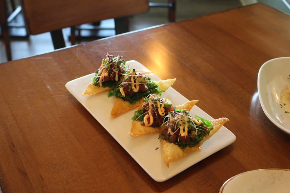 Ahi tuna wonton ($15) consists of a seaweed salad with wasabi tobiko and sriracha aioli. (Peyton MacKenzie/Community Impact Newspaper)