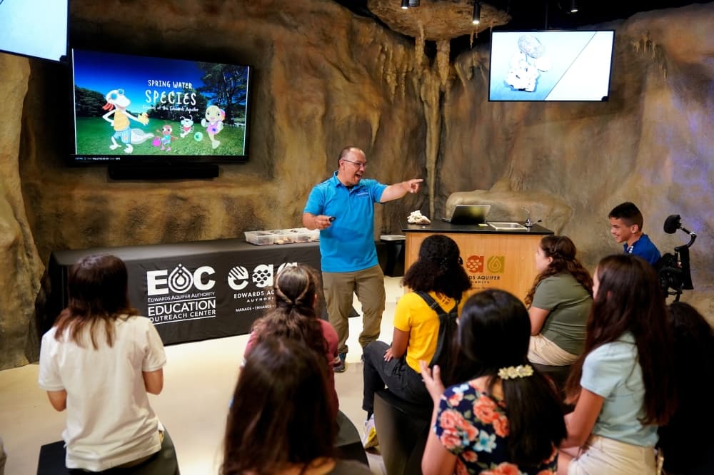 Edwards Aquifer Authority staff members teach visitors and classes of students about the aquifer in the Karst Theater, which was designed to look like a cave with stalagmites. (Courtesy Edwards Aquifer Authority)
