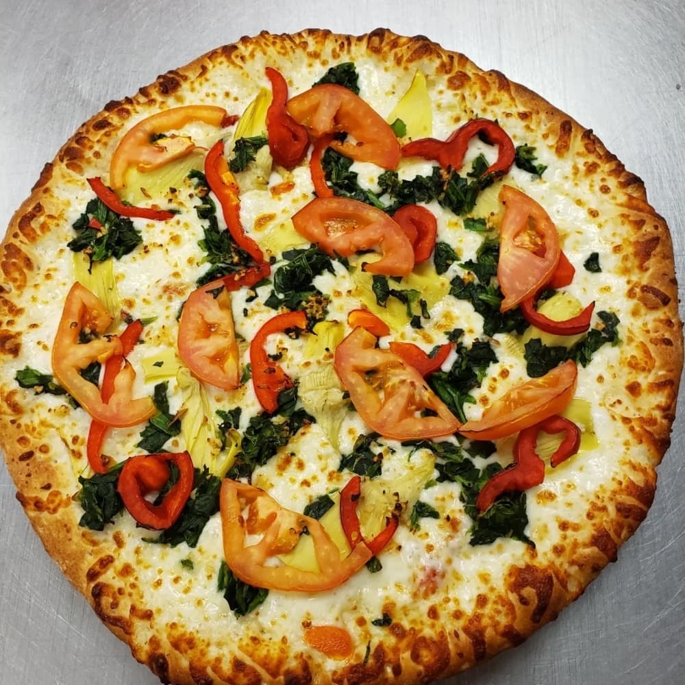 The Mediterranean pizza includes artichokes, spinach, garlic, sun-dried tomatoes, red bell peppers and tomatoes. (Courtesy Kenneth Flores/Pizza Parlor Pearland)