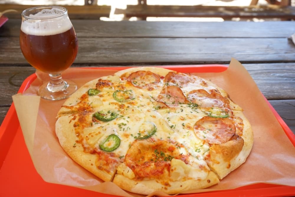 
A personalized 12-inch pizza ($11-$20) made with fresh ingredients and thin crust pairs well with the Extra Special Bitter beer from the brewery. $4/5 oz.
