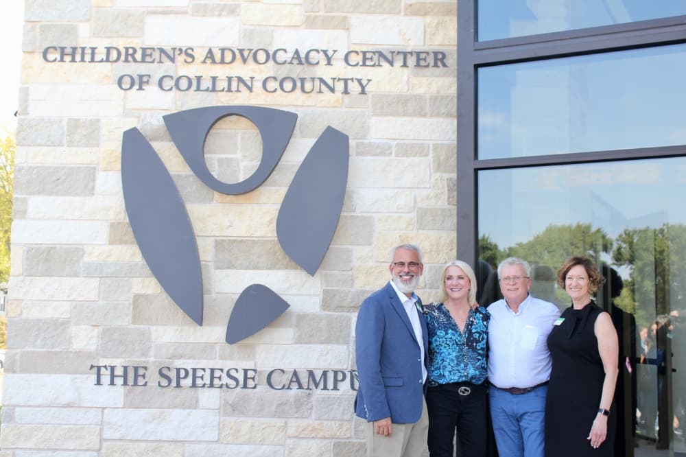 Mark and Carolyn Speese, Dan Powers and Lynne McLean posing in the front of the building.