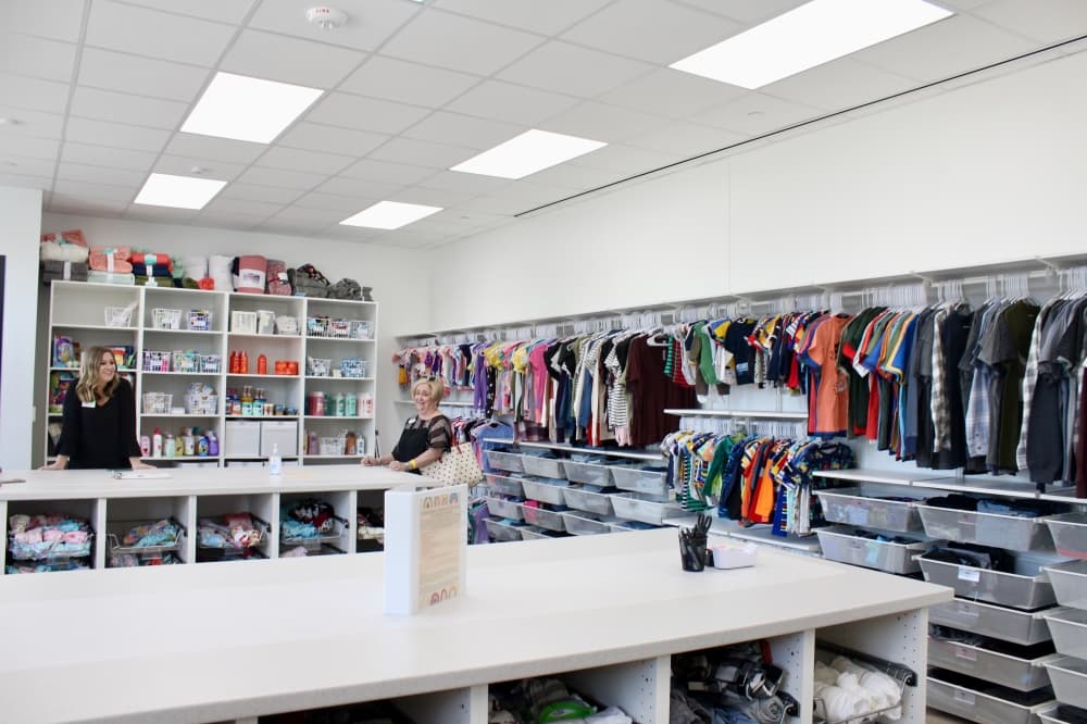 Room with rows of clothes.
