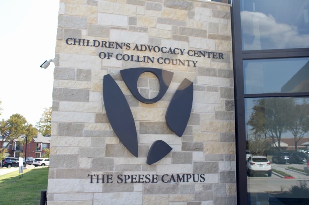 Organization logo and name on the outside of the building.