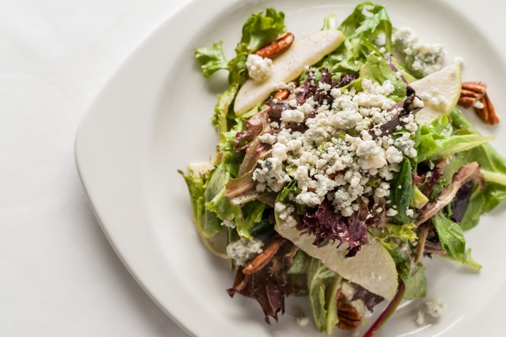 The III Forks Salad ($15) features toasted pecans, blue cheese, Granny Smith apples and a maple-pecan vinaigrette. (Courtesy III Forks)