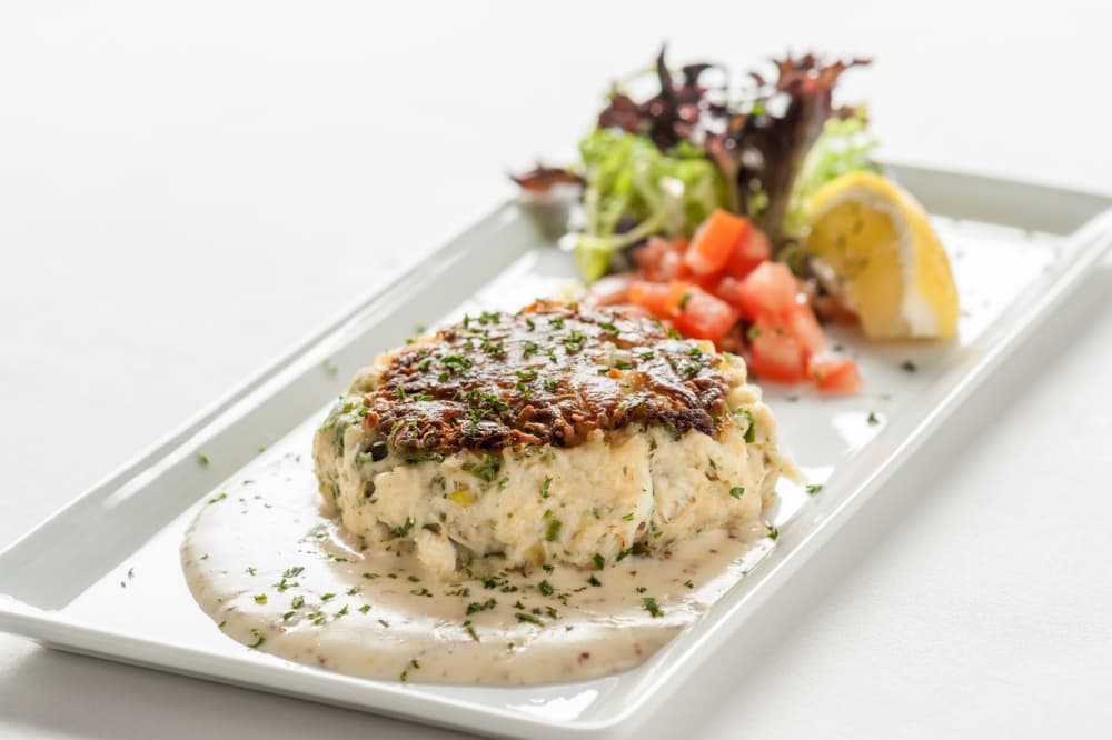 The crabcake ($24) is served with a Creole beurre blanc. (Courtesy III Forks)