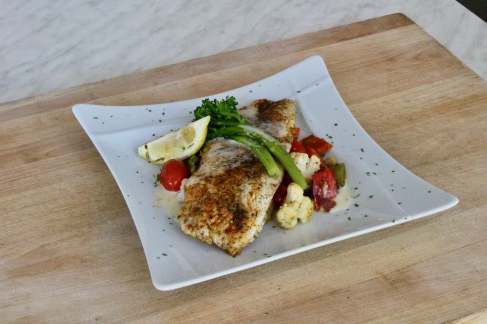 
The barramundi sea bass ($28) is served with blistered tomato and seasonal harvest vegetables.