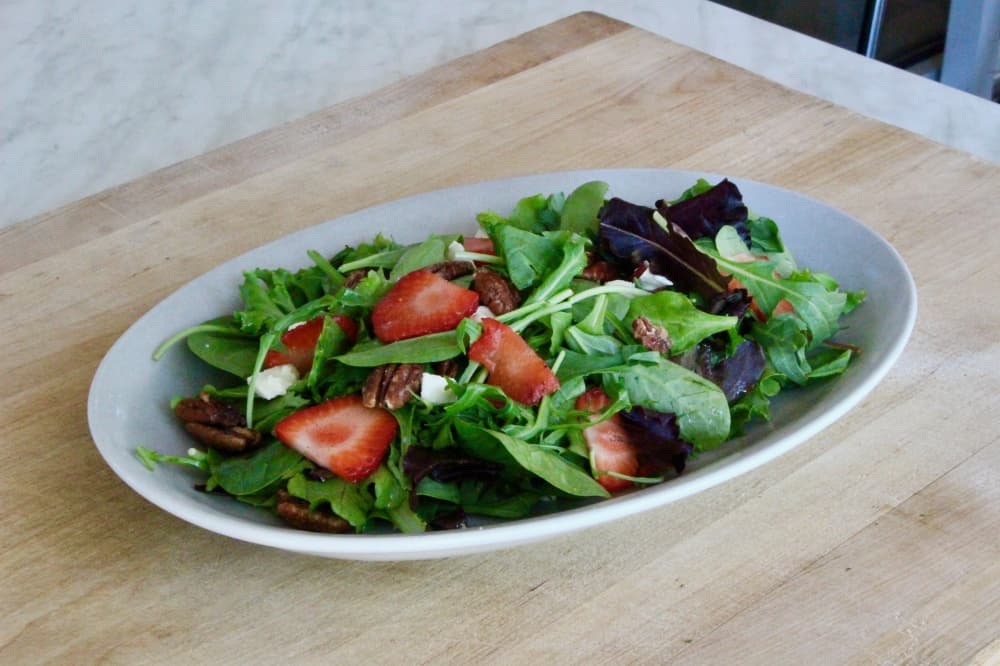 
The Porta’Vino Salad ($6/$10) includes petit greens, mozzarella, strawberries, pecans and a vinaigrette.