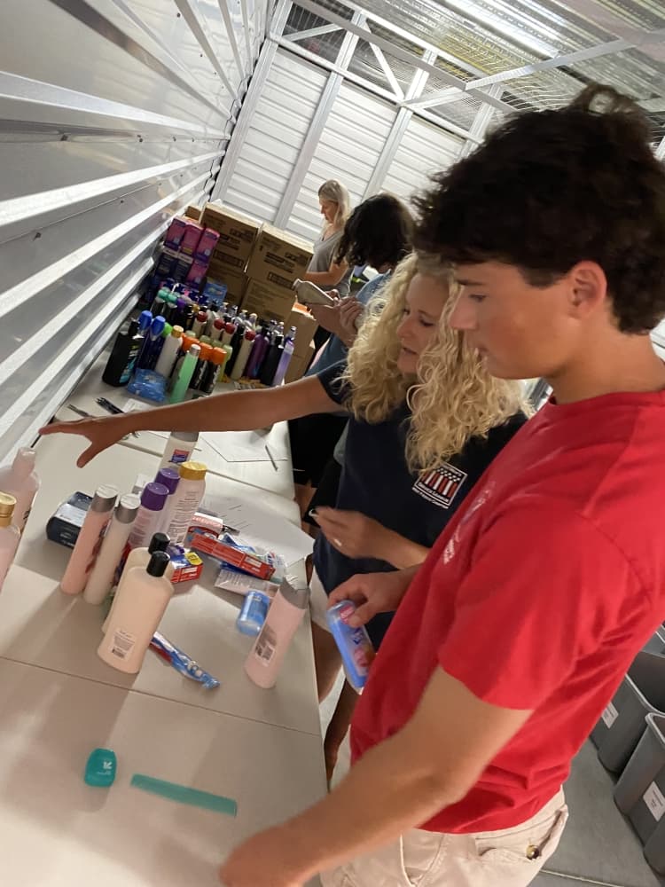 Volunteers help organize and pack products. (Courtesy Refresh Frisco)