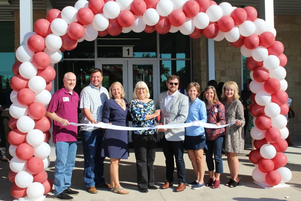 ribbon cutting with balloons