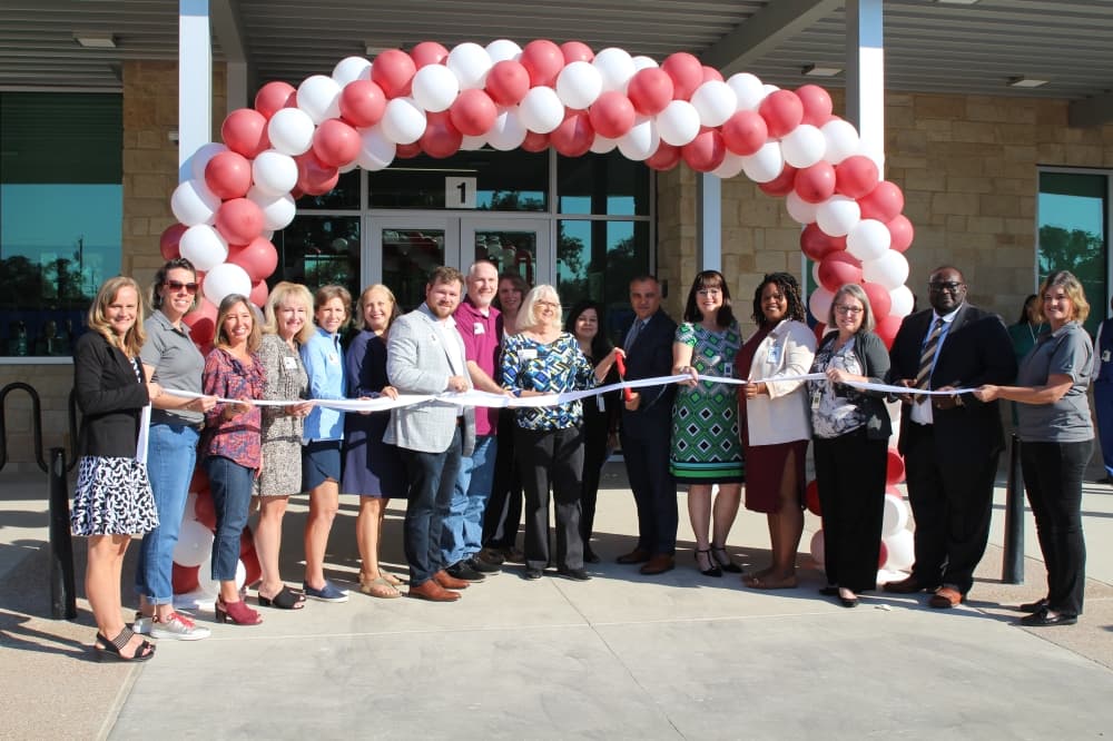 ribbon cutting with balloons