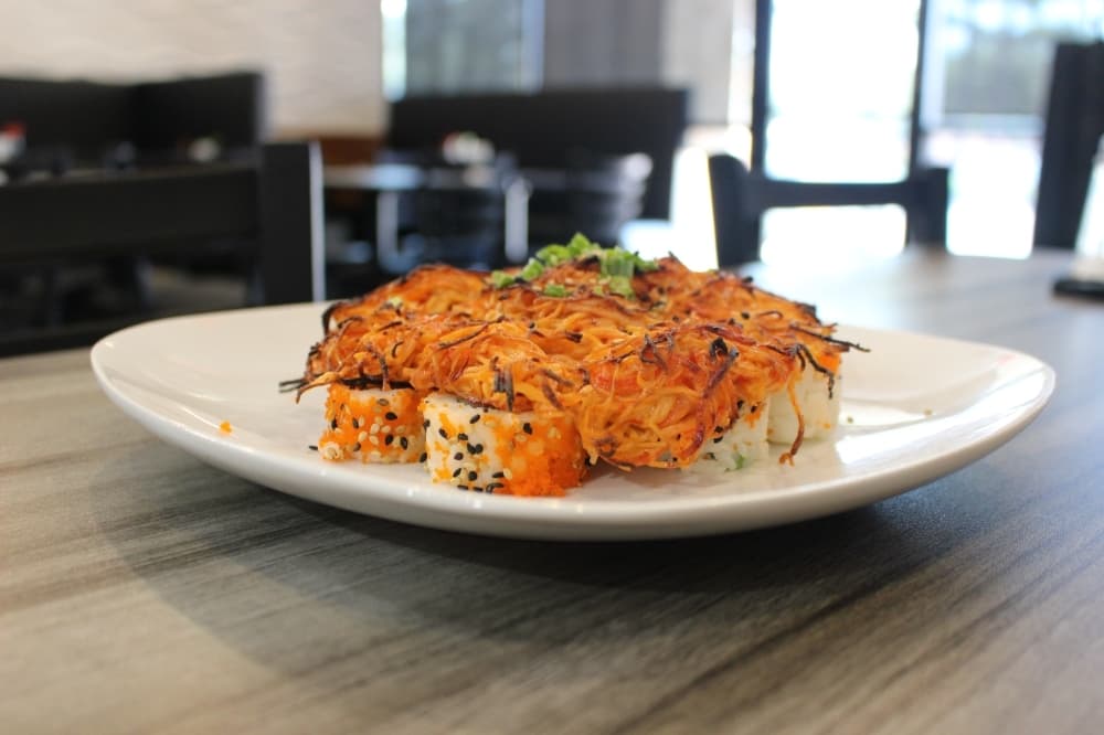 Volcano Roll ($16) is a California roll topped with mixed crab and mayo.