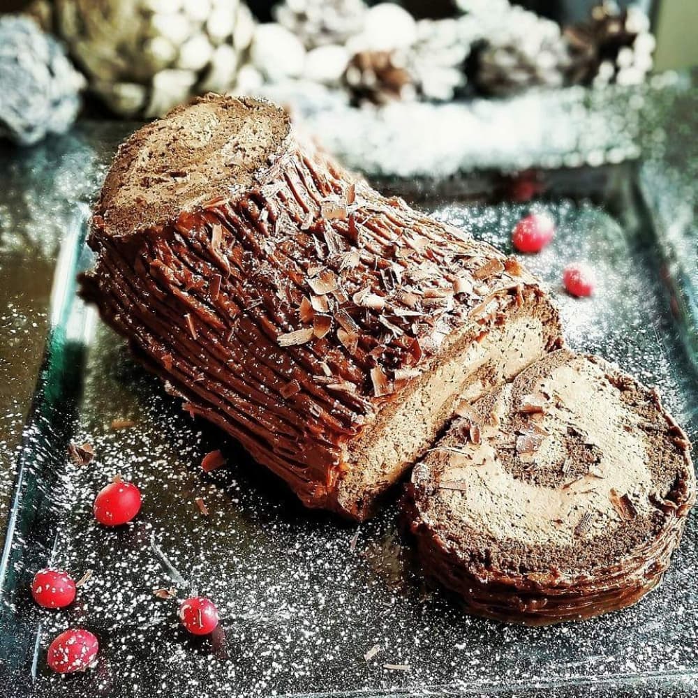 Buche de Noel is a traditional French Christmas cake. The flourless chocolate cake is made into a sweet roulade with chocolate buttercream. (Courtesy Kess Kravings)