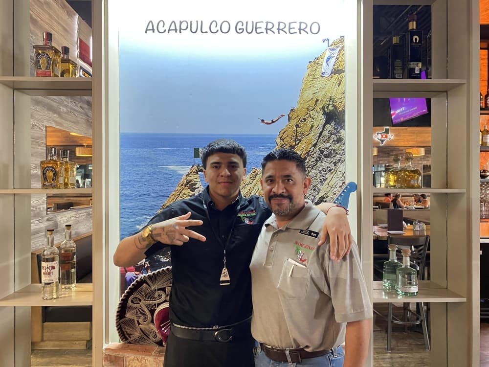 General Manager Pepe Barcenas (right) poses with his son, Adan Barcenas.